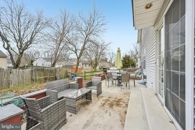 a view of a patio with couches table and chairs