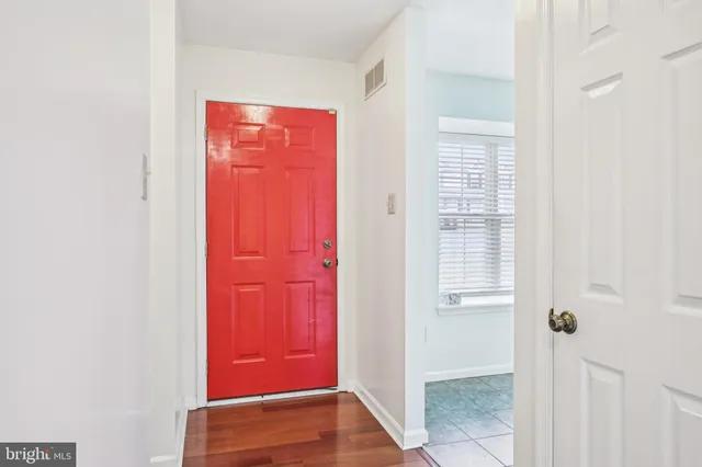 a view of front door with a hallway