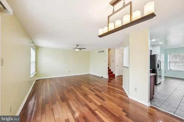 a view of a living room with a wooden floor