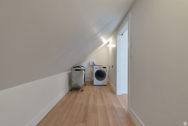 1820 West Farmhouse Flats Road Peoa, UT 84061 - Photo 54 of 79 Dedicated laundry area featuring wood-finish flooring, white baseboards, and sloped ceilings
