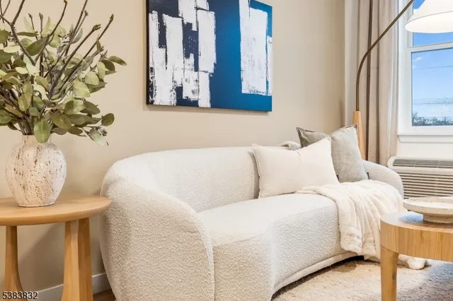 a living room with a couch and a window