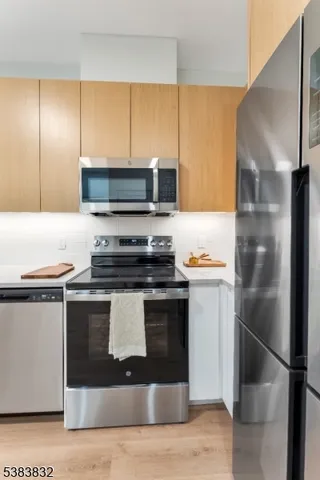 a kitchen with a stove microwave and refrigerator