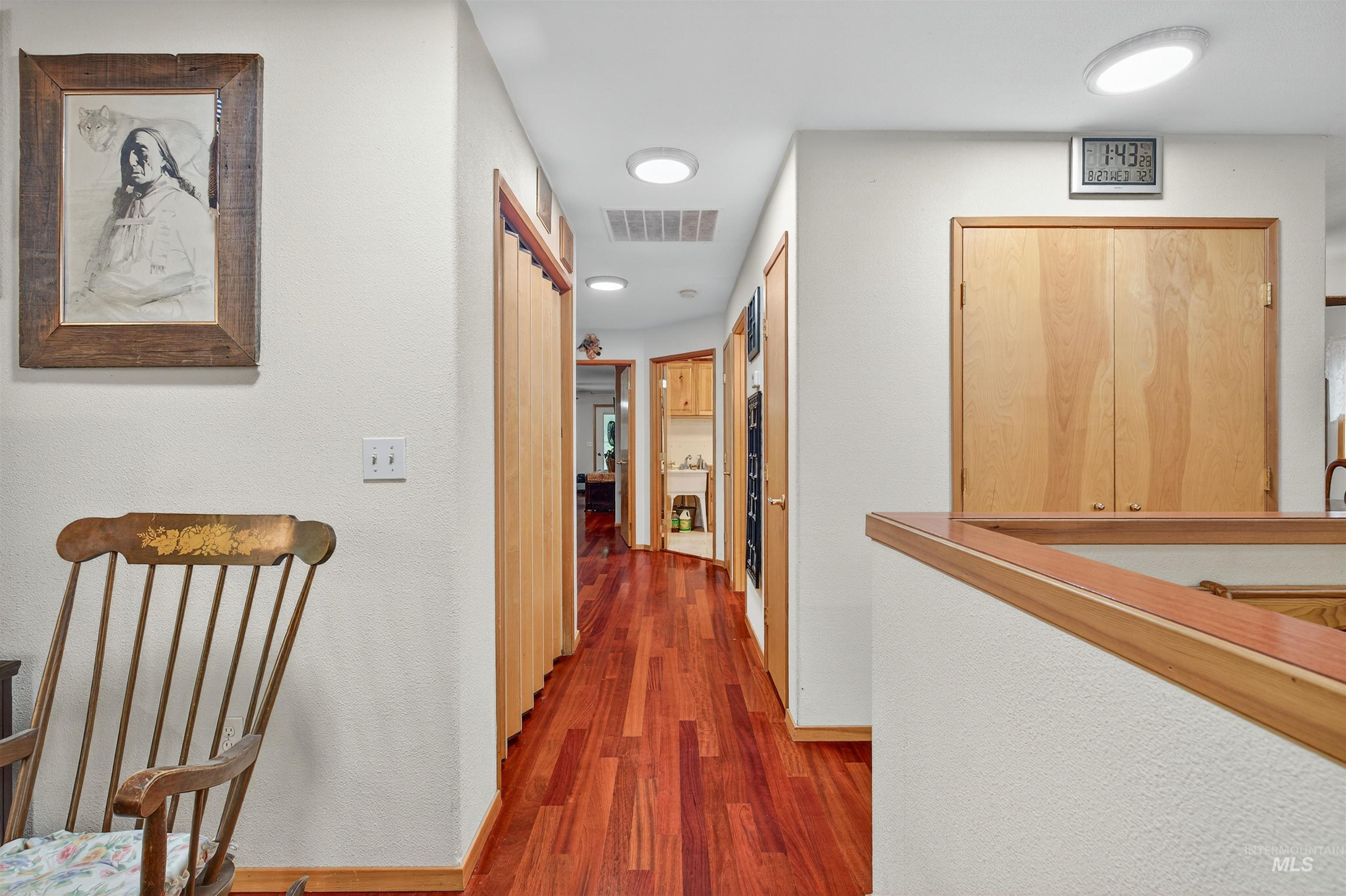 8385 Asotin Creek Road Asotin, WA 99402 - Photo 17 of 46 Hallway with dark wood-type flooring and baseboards