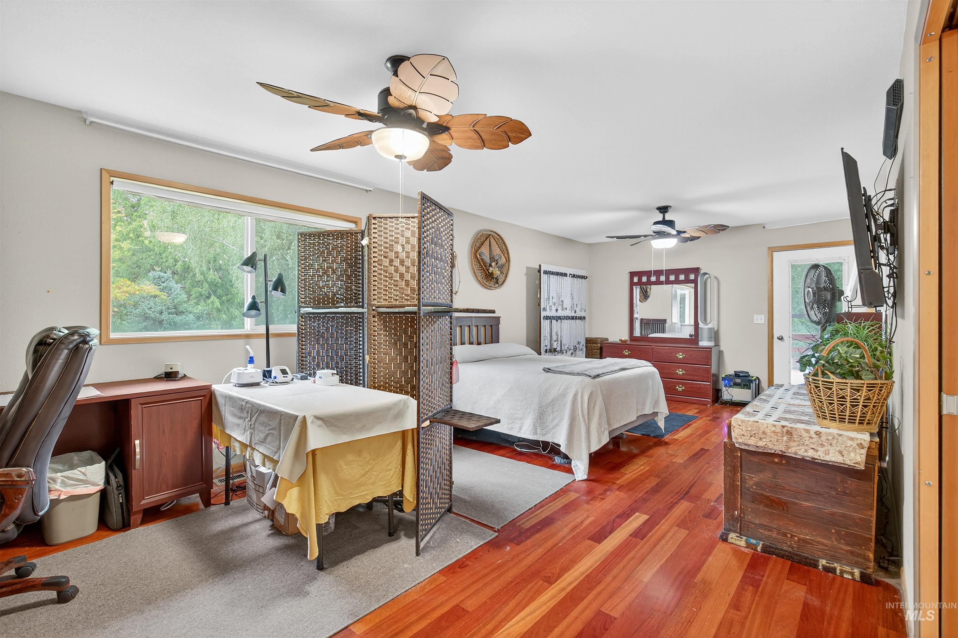 8385 Asotin Creek Road Asotin, WA 99402 - Photo 25 of 46 Bedroom with multiple windows, wood finished floors, and ceiling fan