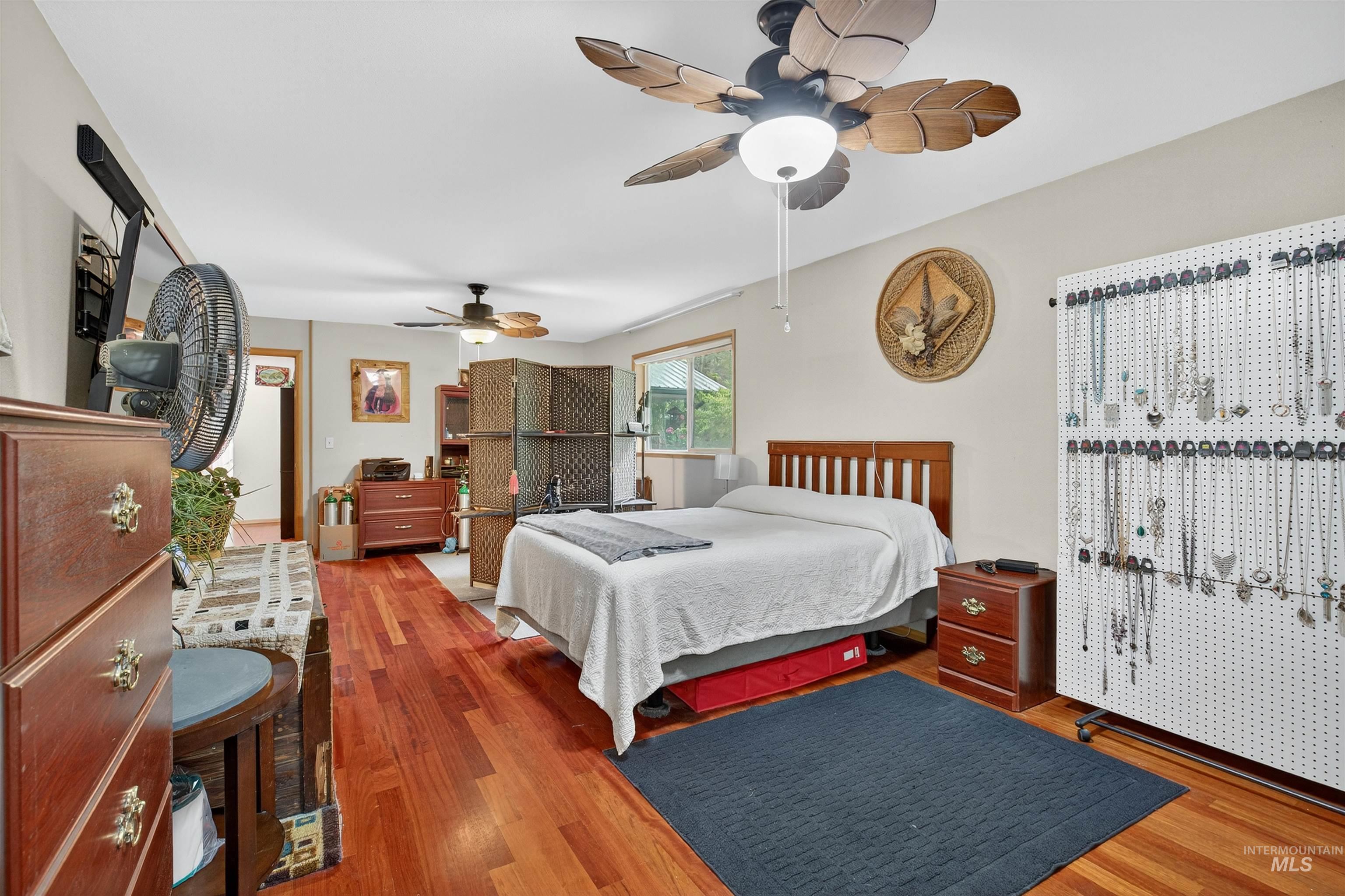 8385 Asotin Creek Road Asotin, WA 99402 - Photo 27 of 46 Bedroom with wood finished floors and a ceiling fan