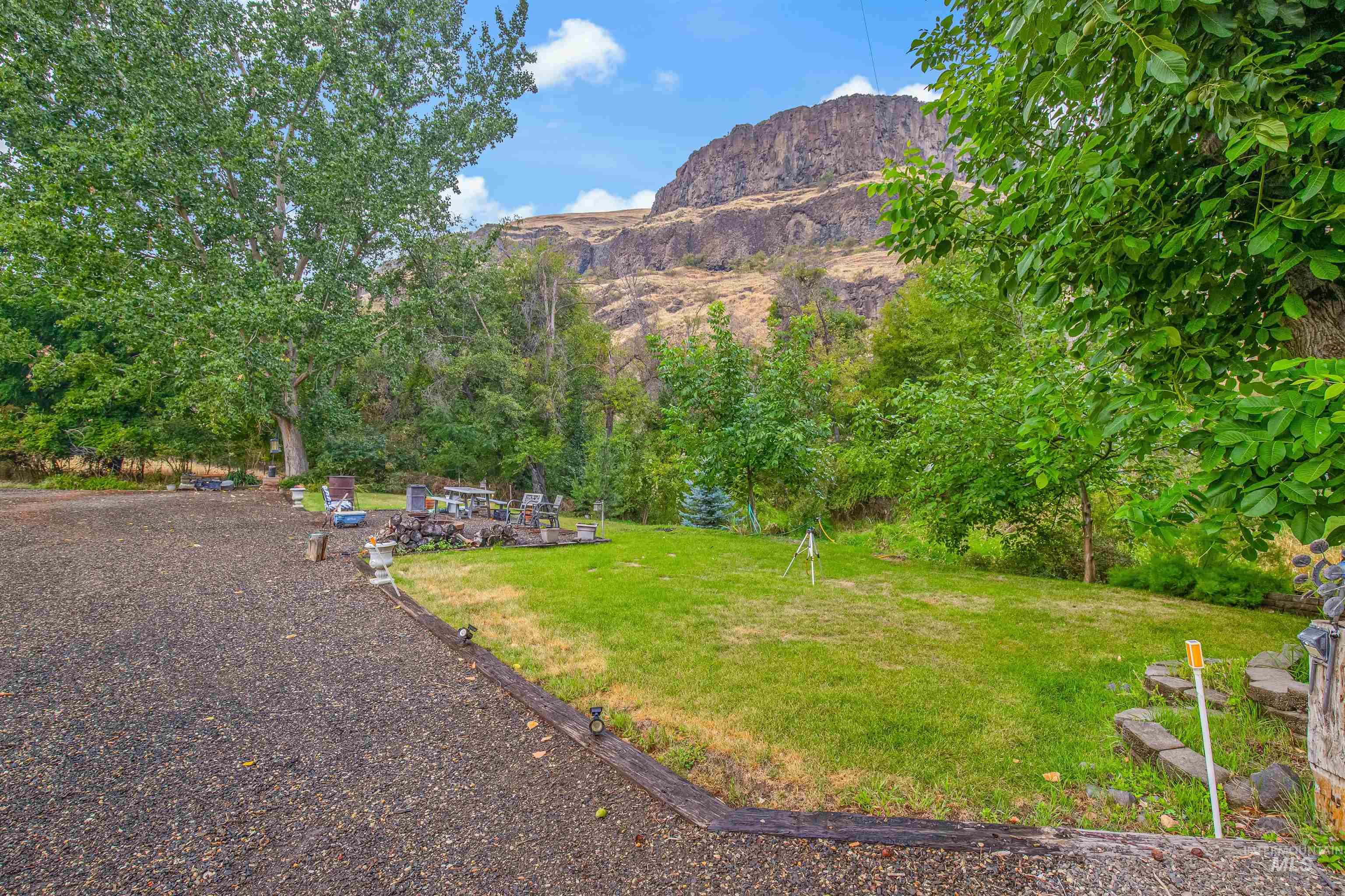 8385 Asotin Creek Road Asotin, WA 99402 - Photo 39 of 46 View of grassy yard with a mountain view and a patio area