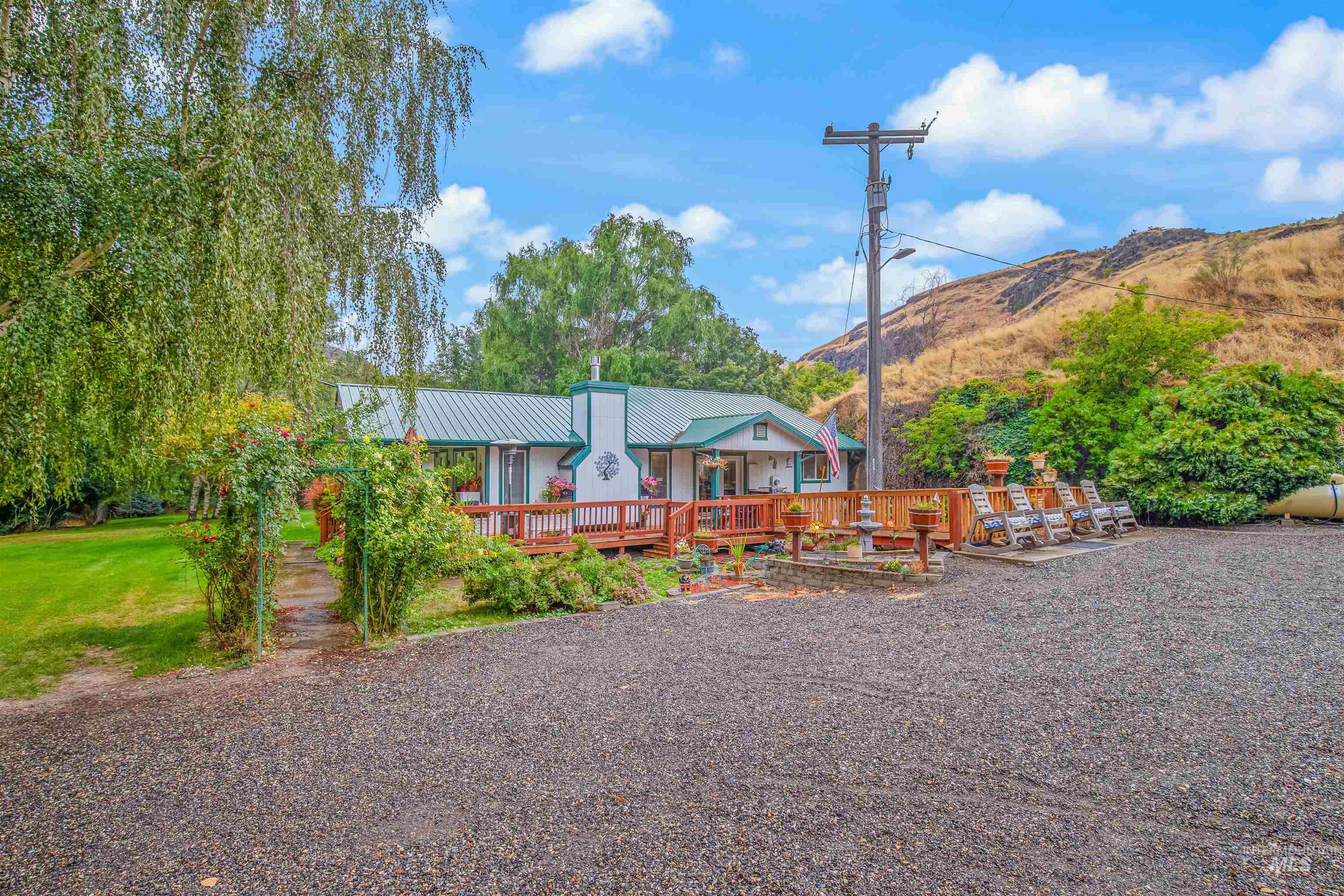 8385 Asotin Creek Road Asotin, WA 99402 - Photo 4 of 46 View of front of home featuring a metal roof and a deck with mountain view