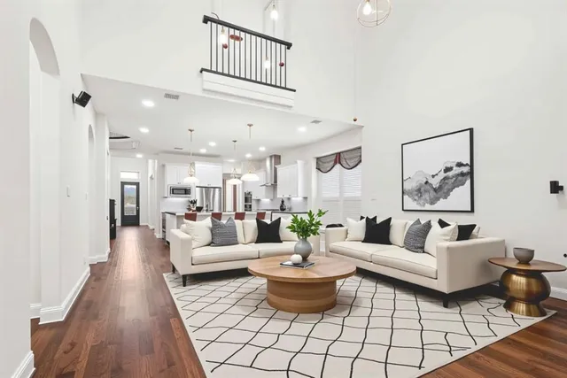 a living room with furniture and a rug