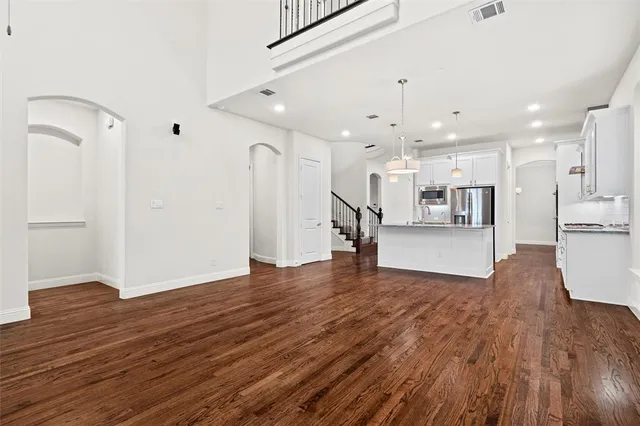 a view of kitchen with furniture and wooden floor
