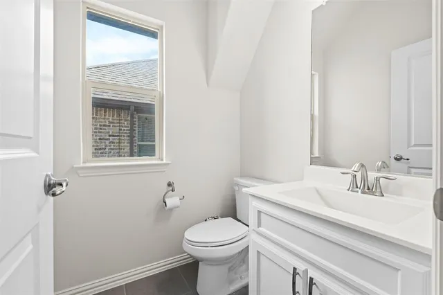 a picture of a bathroom with a sink and a mirror