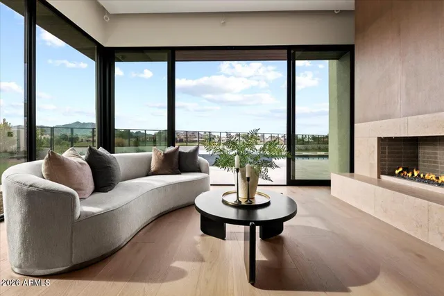 a living room with furniture and a potted plant