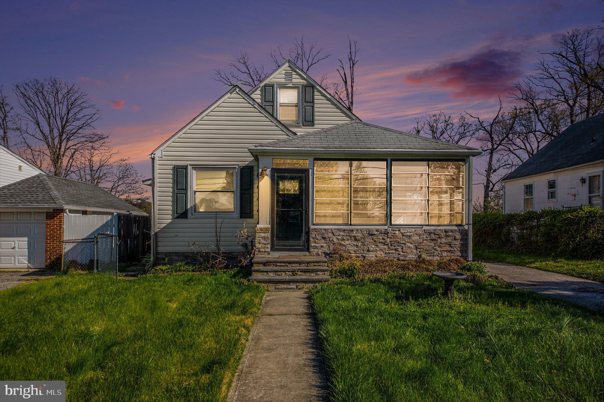 1750 Forrest Avenue Baltimore, MD 21234 - Photo 1 of 25 a front view of a house with a yard