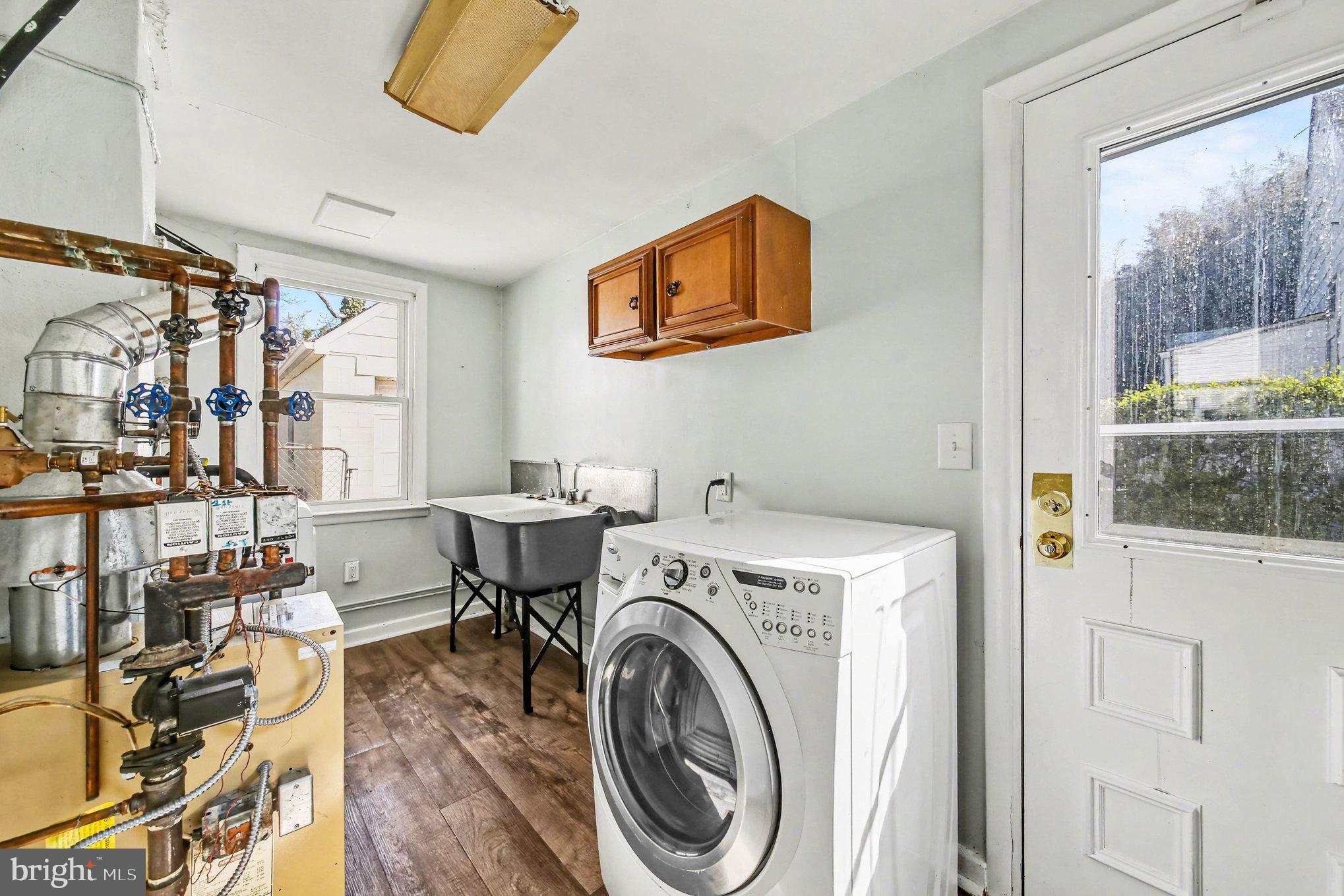 1750 Forrest Avenue Baltimore, MD 21234 - Photo 17 of 25 a view of livingroom with washer and dryer