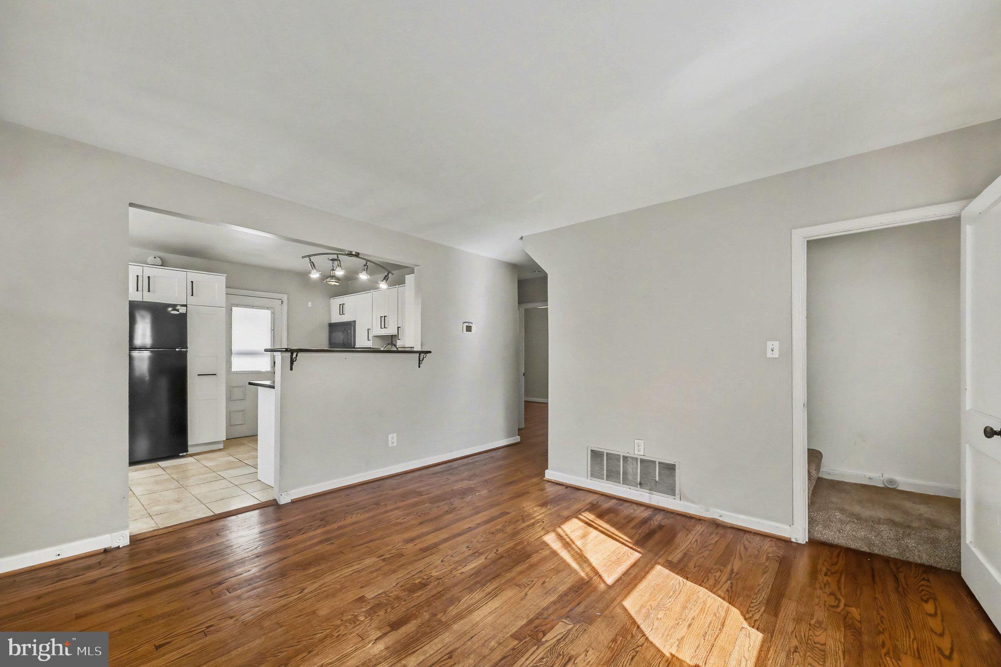 1750 Forrest Avenue Baltimore, MD 21234 - Photo 9 of 25 a view of empty room with wooden floor