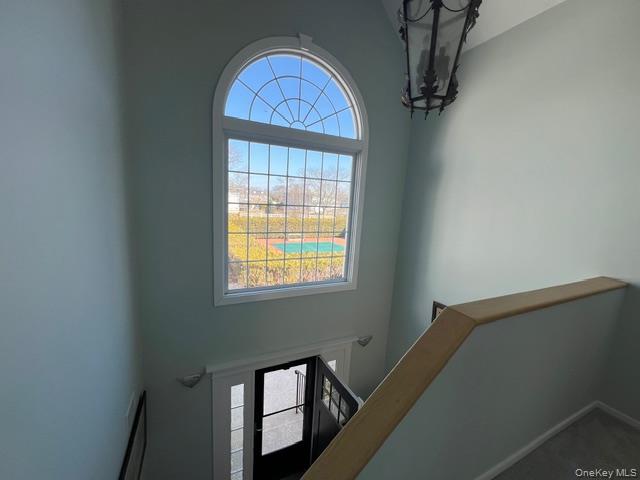 25 Mitchell Road, Unit 3 Westhampton Beach, NY 11978 - Photo 11 of 18 a view of wooden floor in a room