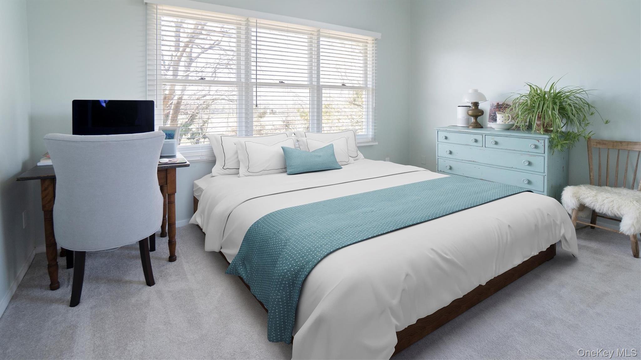 25 Mitchell Road, Unit 3 Westhampton Beach, NY 11978 - Photo 12 of 18 a bedroom with a bed window table chair and television