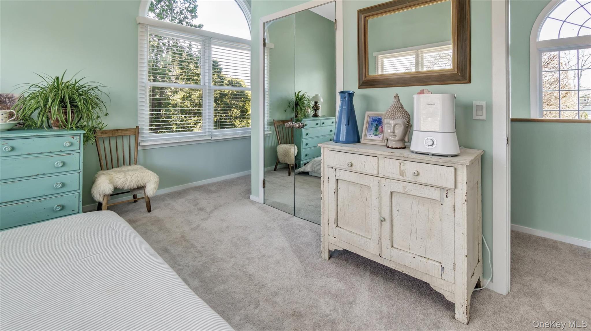 25 Mitchell Road, Unit 3 Westhampton Beach, NY 11978 - Photo 13 of 18 a living room with furniture and a window