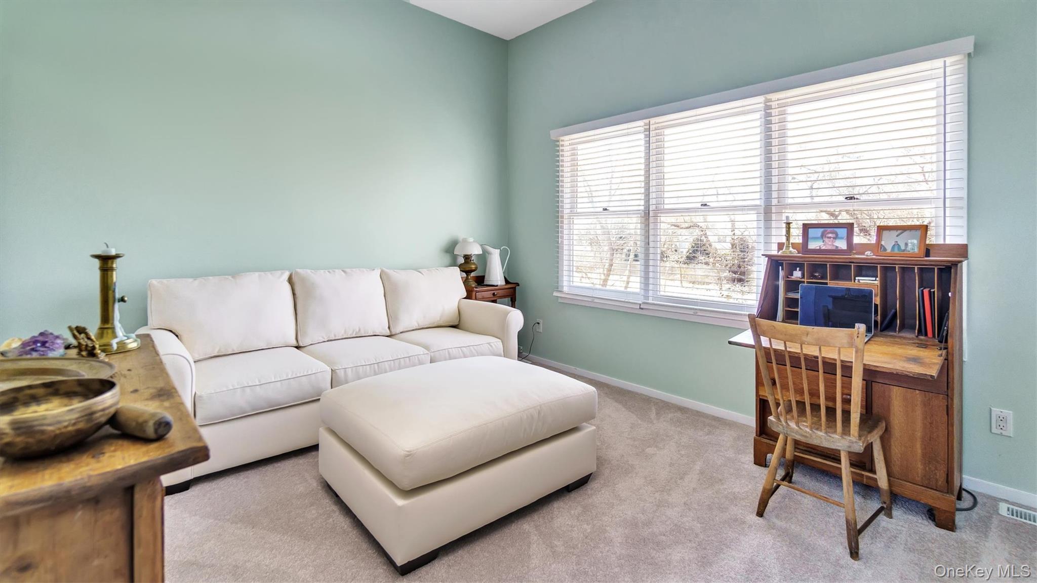 25 Mitchell Road, Unit 3 Westhampton Beach, NY 11978 - Photo 14 of 18 a living room with furniture and a window
