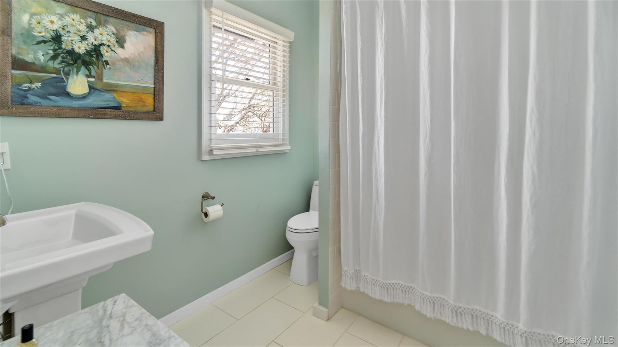 25 Mitchell Road, Unit 3 Westhampton Beach, NY 11978 - Photo 15 of 18 a bathroom with a toilet and a sink