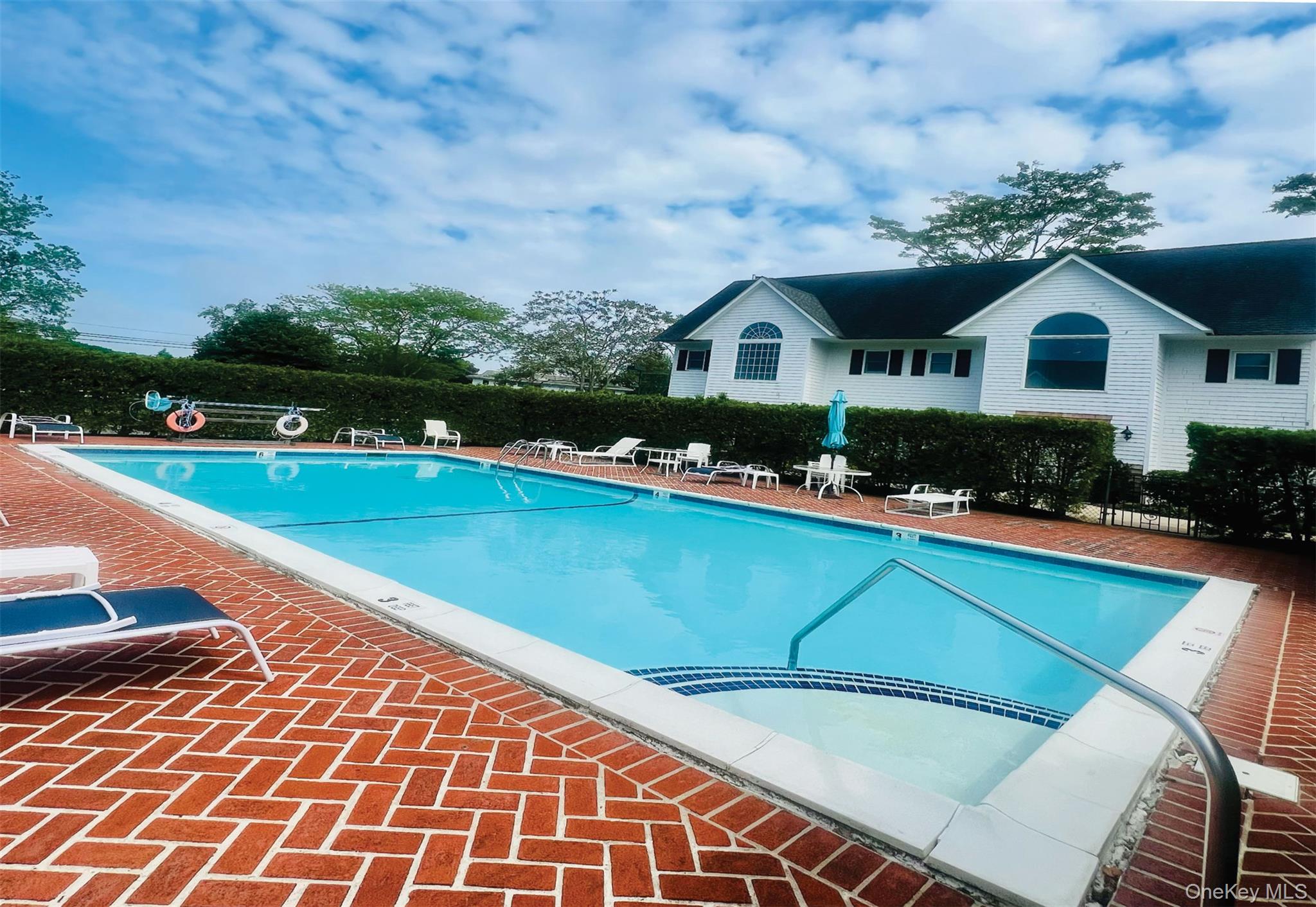 25 Mitchell Road, Unit 3 Westhampton Beach, NY 11978 - Photo 2 of 18 a front view of a house with garden