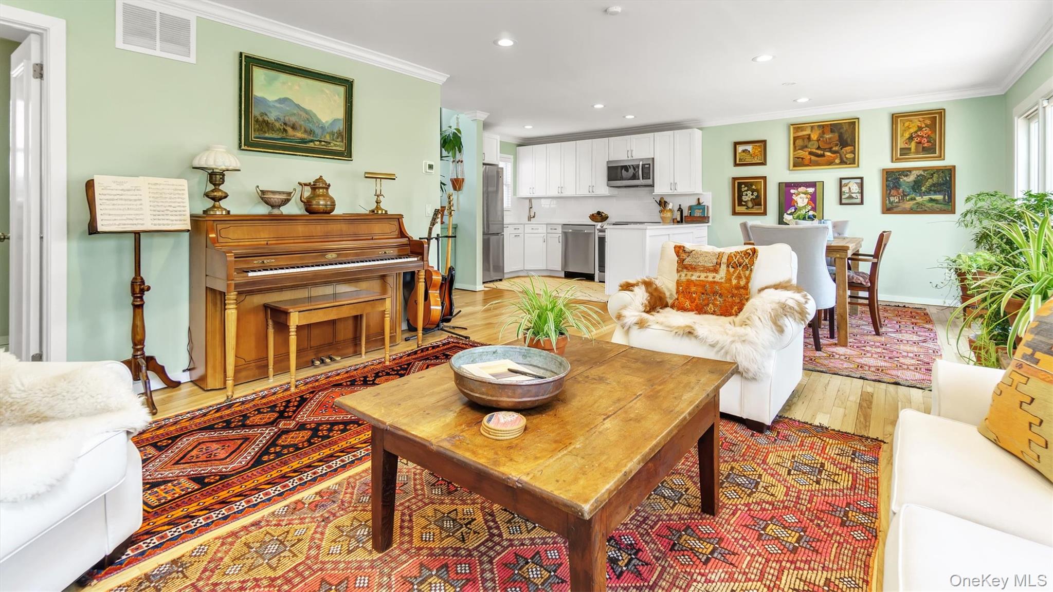 25 Mitchell Road, Unit 3 Westhampton Beach, NY 11978 - Photo 4 of 18 a living room with fireplace furniture and a table