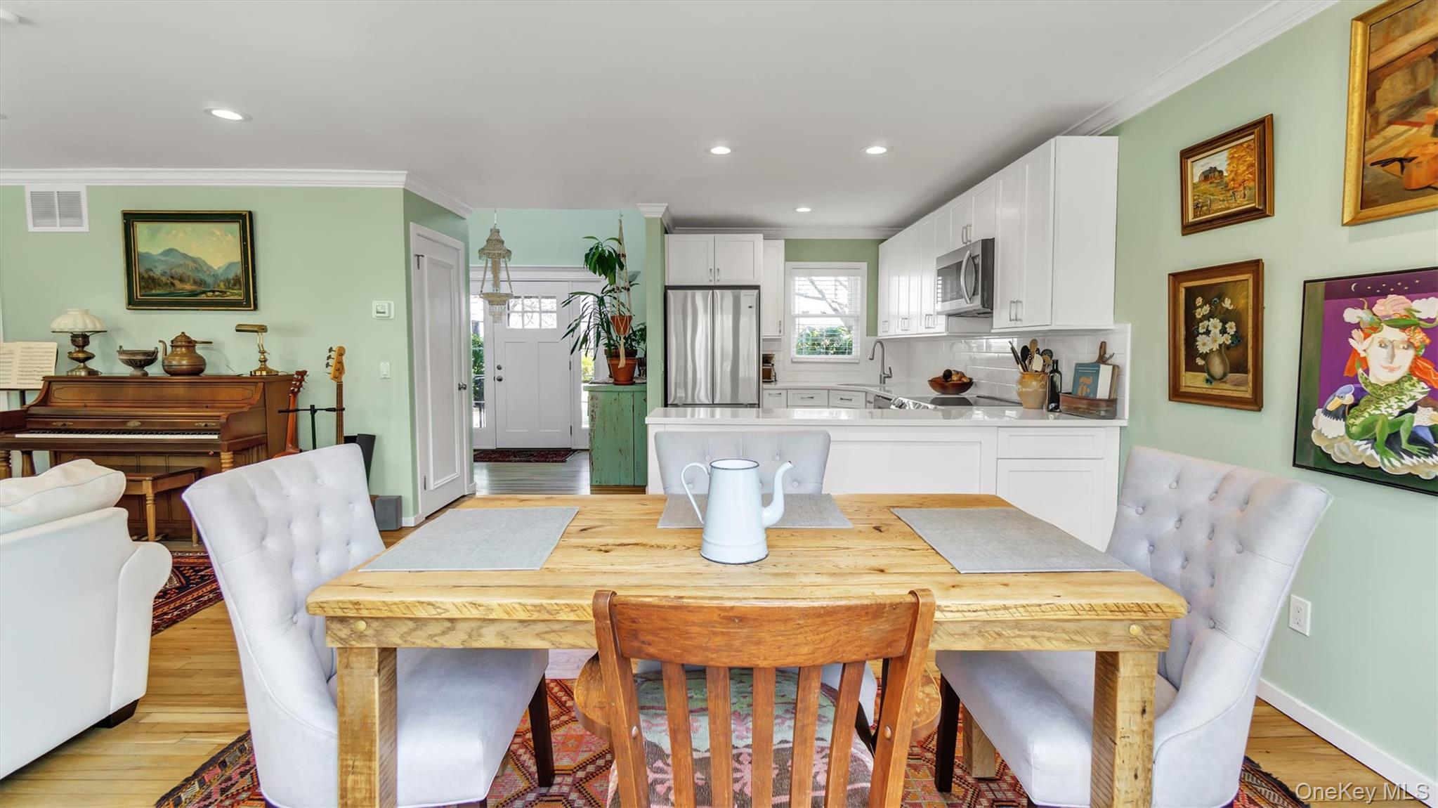25 Mitchell Road, Unit 3 Westhampton Beach, NY 11978 - Photo 8 of 18 a view of a dining room with furniture and wooden floor
