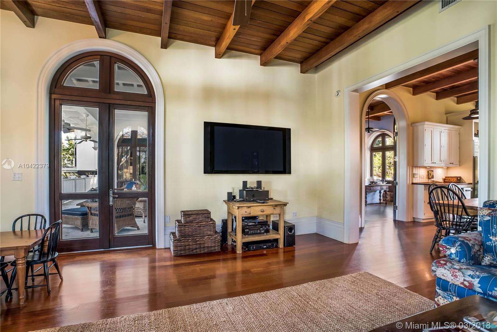 14 Harbor Point Key Biscayne, FL 33149 - Photo 13 of 45 a living room with furniture a wooden floor and a flat screen tv