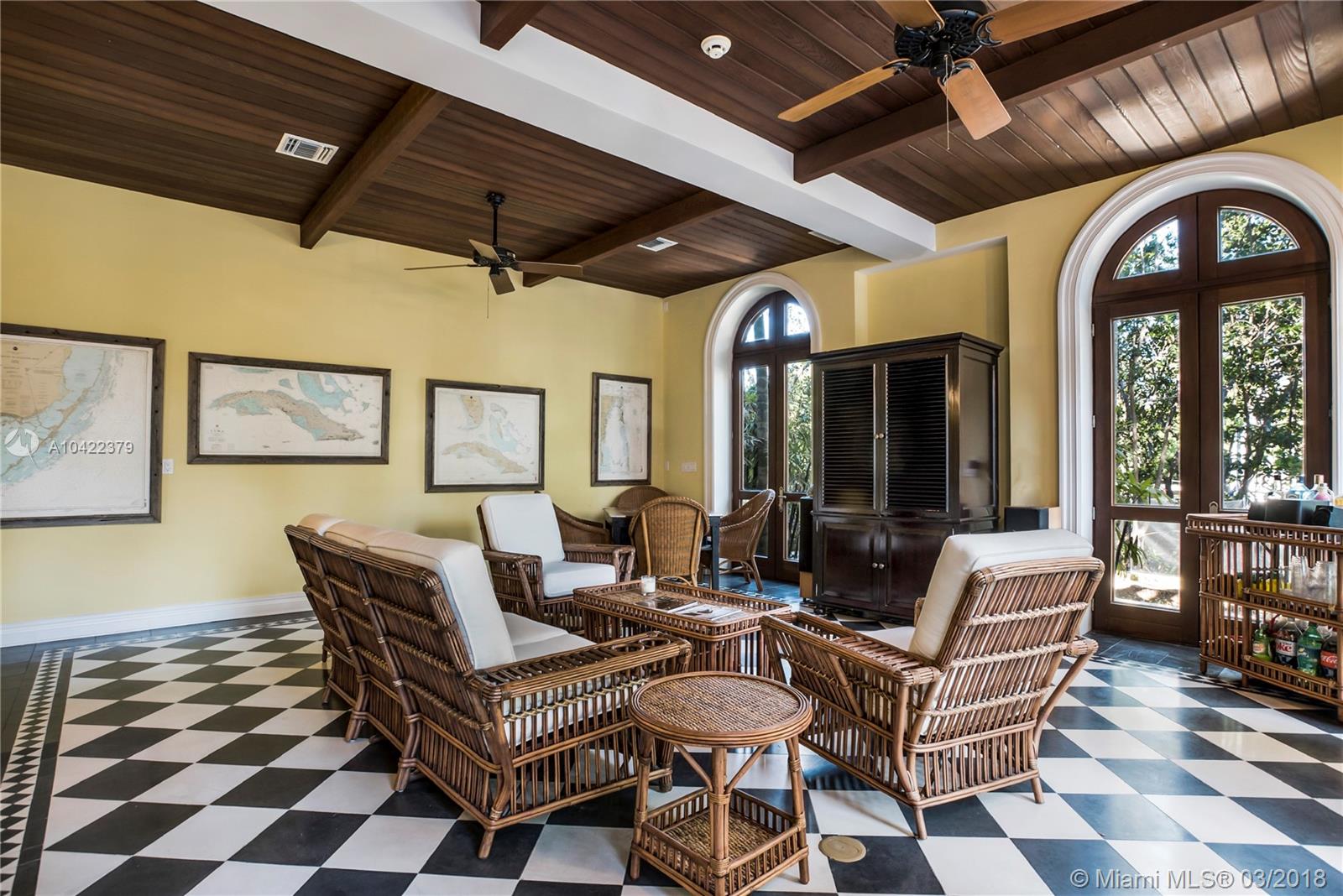 14 Harbor Point Key Biscayne, FL 33149 - Photo 17 of 45 a living room with patio furniture and a large window