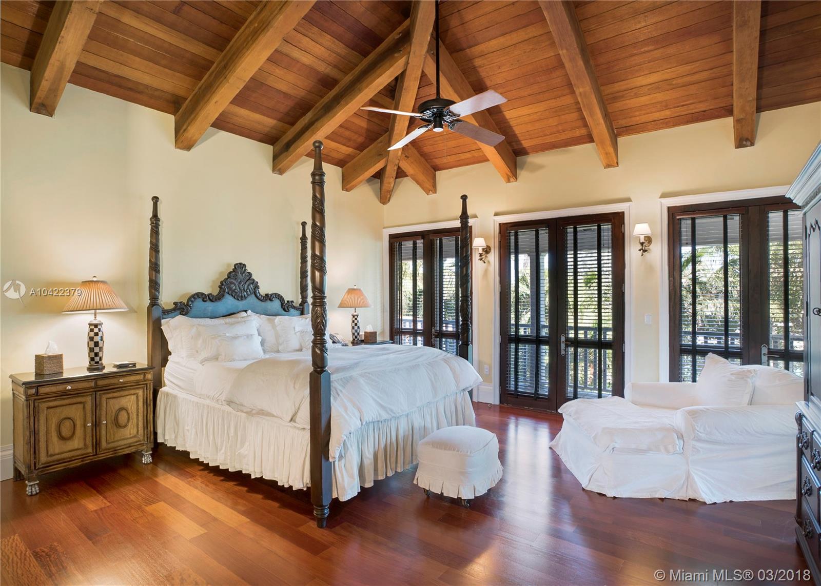 14 Harbor Point Key Biscayne, FL 33149 - Photo 19 of 45 a spacious bedroom with a bed and large window
