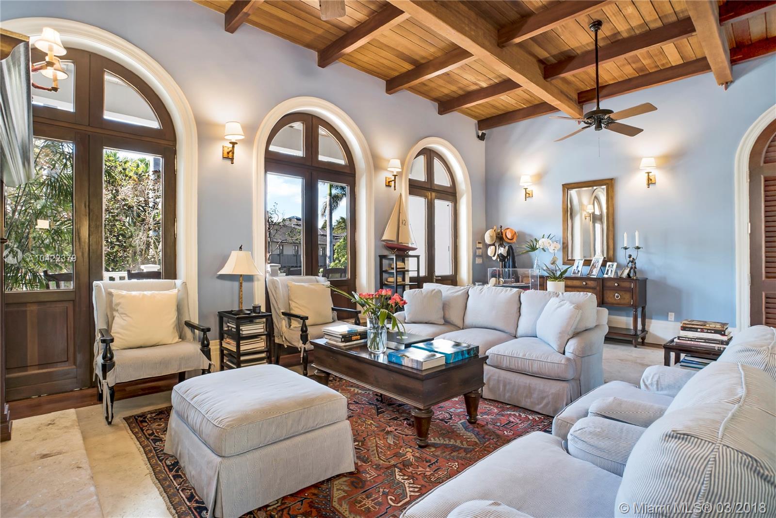 14 Harbor Point Key Biscayne, FL 33149 - Photo 3 of 45 a living room with patio furniture and a large window