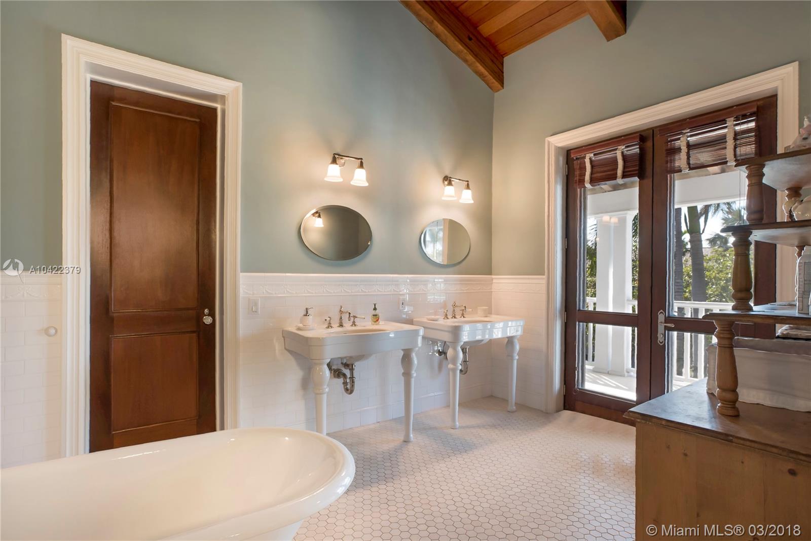 14 Harbor Point Key Biscayne, FL 33149 - Photo 23 of 45 a bathroom with a sink a toilet and mirror