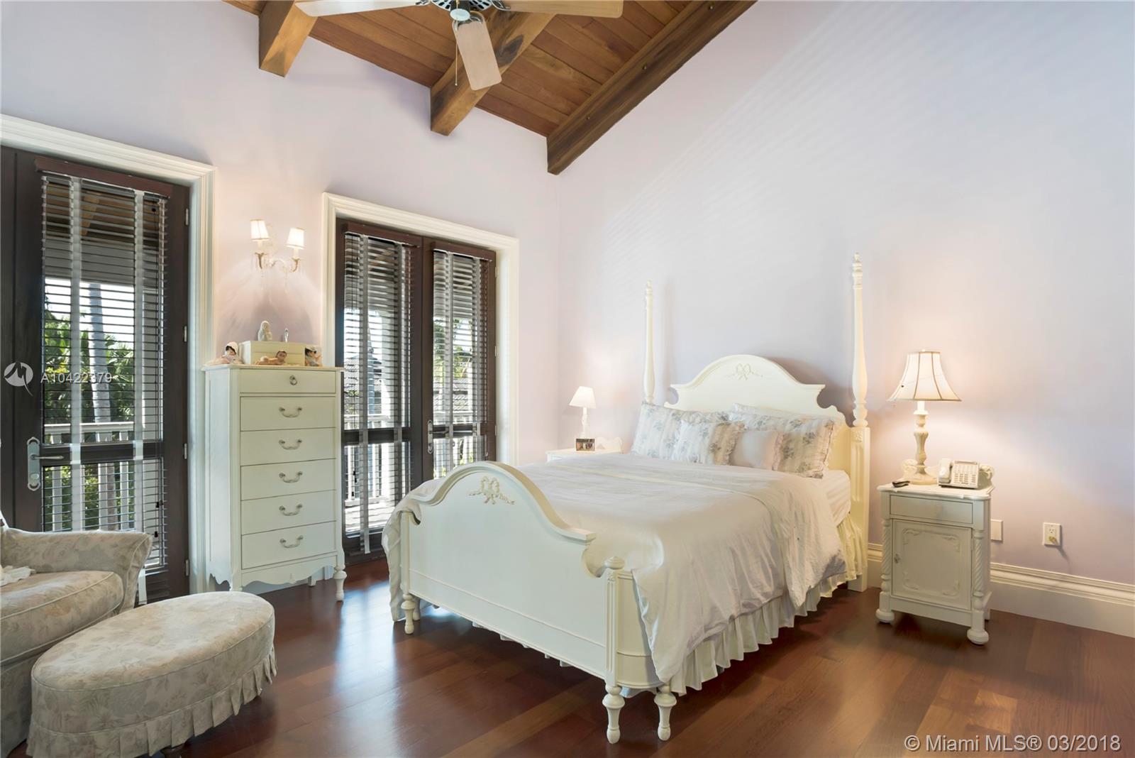 14 Harbor Point Key Biscayne, FL 33149 - Photo 24 of 45 a bedroom with a bed and wooden floor