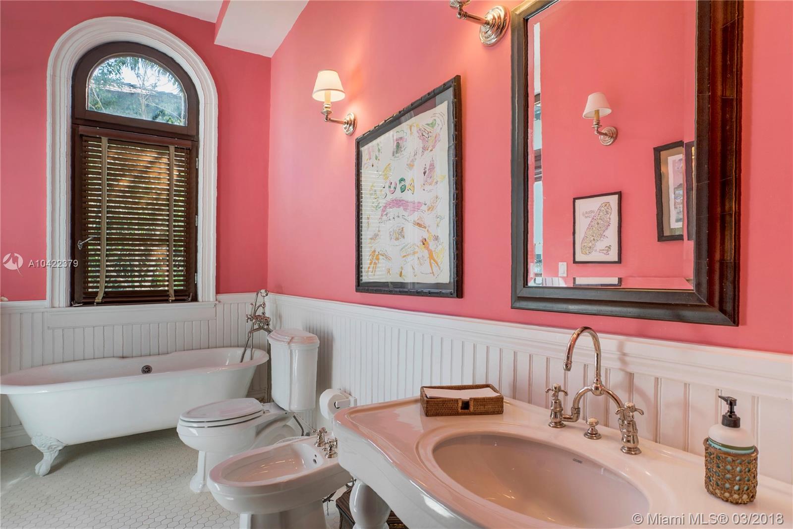 14 Harbor Point Key Biscayne, FL 33149 - Photo 26 of 45 a bathroom with a two sinks a toilet and a bathtub next to a window