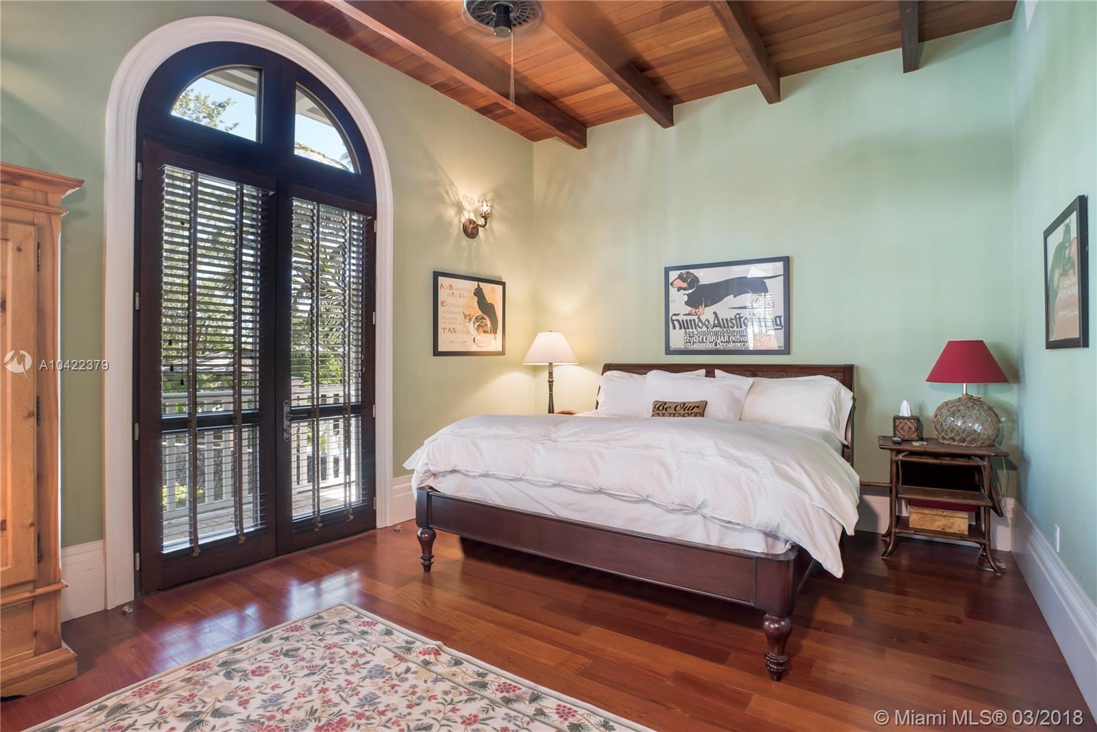 14 Harbor Point Key Biscayne, FL 33149 - Photo 28 of 45 a bedroom with a bed a dresser next to a window