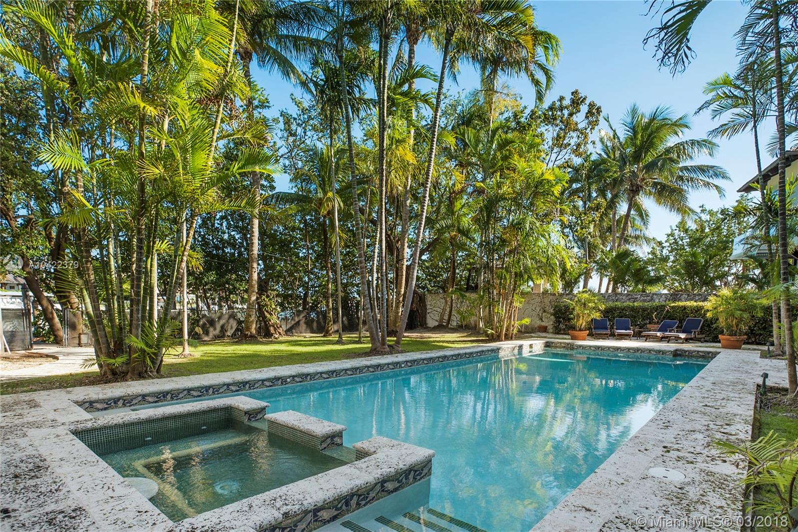 14 Harbor Point Key Biscayne, FL 33149 - Photo 33 of 45 a view of swimming pool with a yard and trees