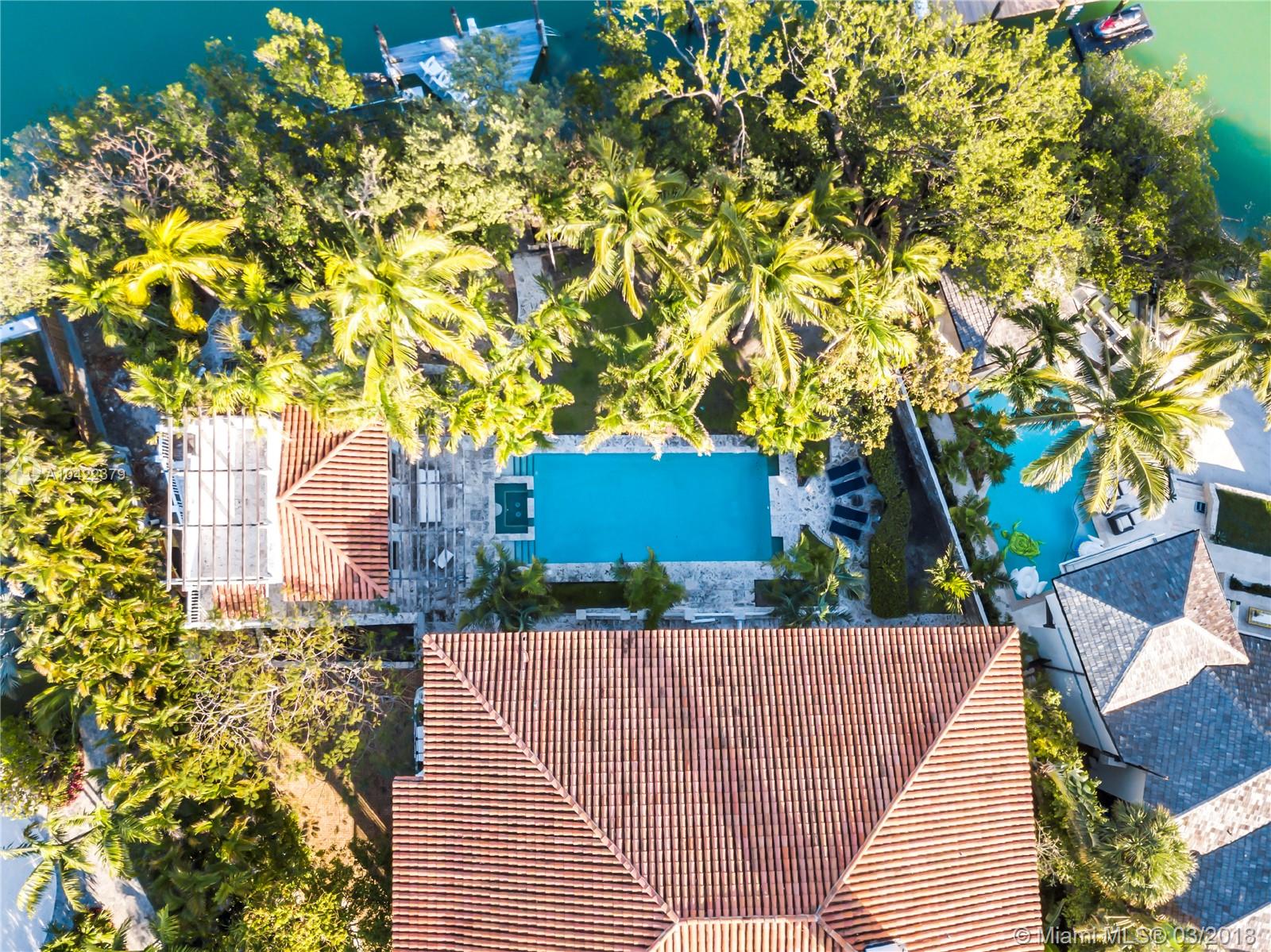 14 Harbor Point Key Biscayne, FL 33149 - Photo 39 of 45 a front view of a house with a yard