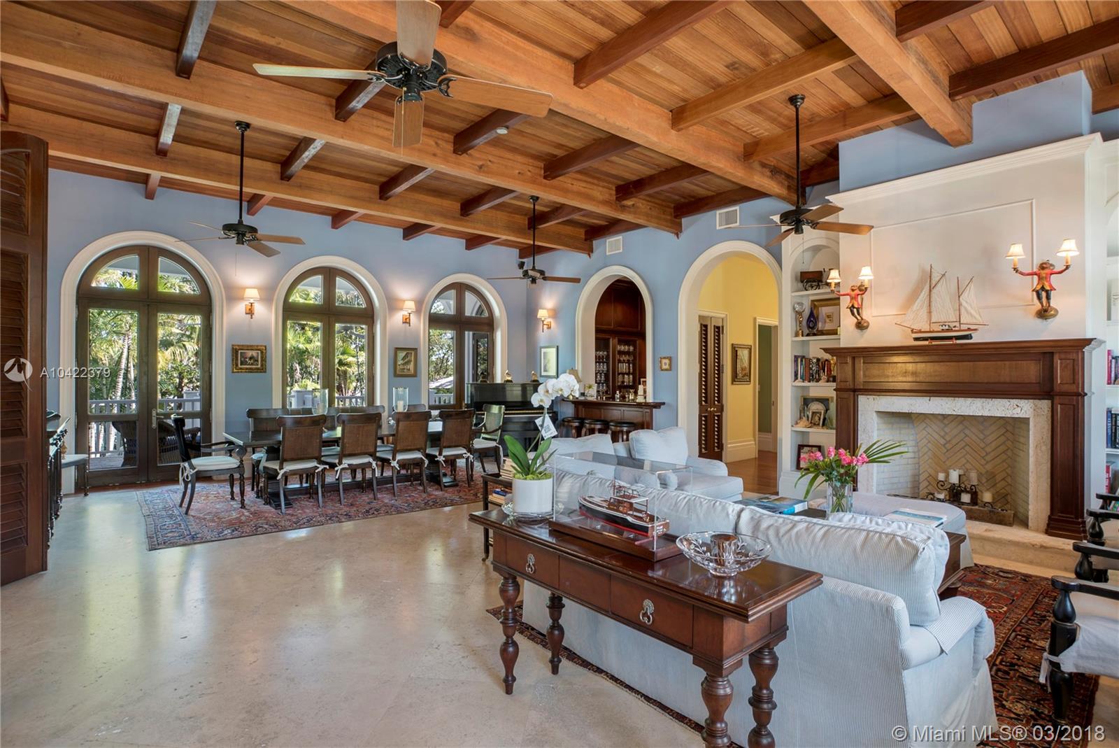 14 Harbor Point Key Biscayne, FL 33149 - Photo 5 of 45 a living room with furniture a fireplace and large windows