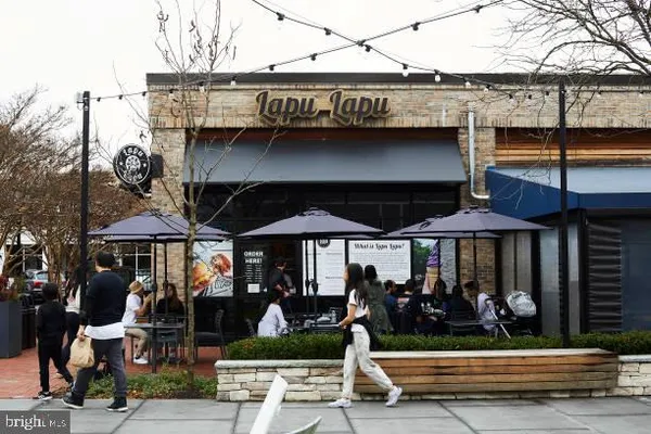 a view of a lake with tall building