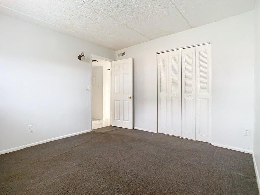 694 Michigan Court, Unit 3 St. Cloud, FL 34769 - Photo 11 of 24 a view of an empty room