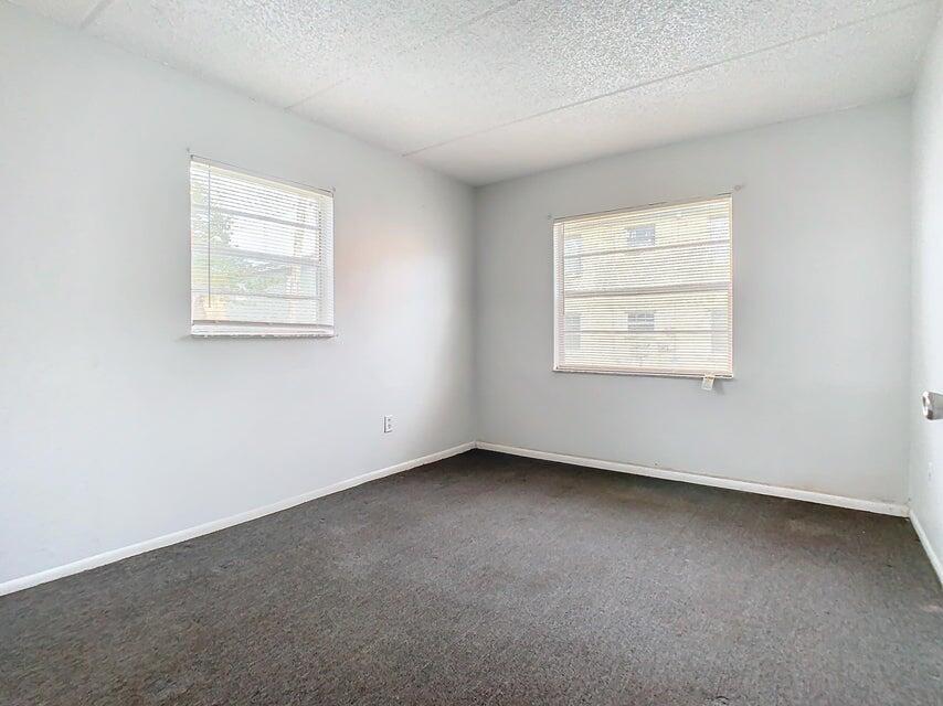 694 Michigan Court, Unit 3 St. Cloud, FL 34769 - Photo 15 of 24 an empty room with a window