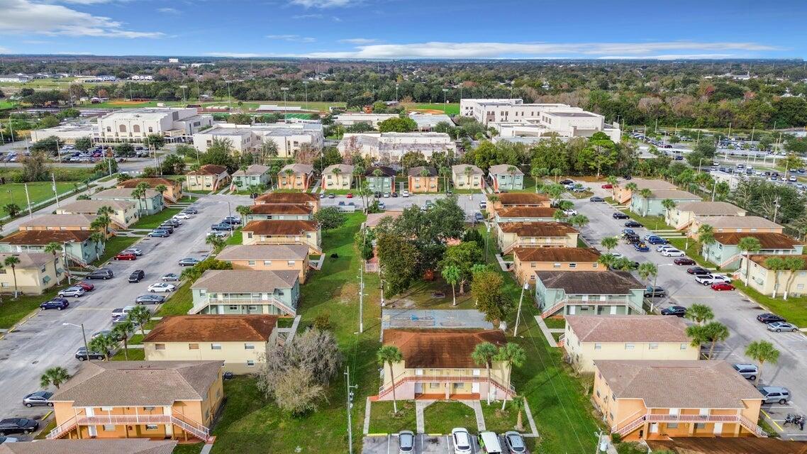 694 Michigan Court, Unit 3 St. Cloud, FL 34769 - Photo 19 of 24 an aerial view of residential houses with outdoor space