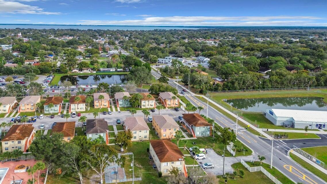 694 Michigan Court, Unit 3 St. Cloud, FL 34769 - Photo 22 of 24 a view of a city with a lake