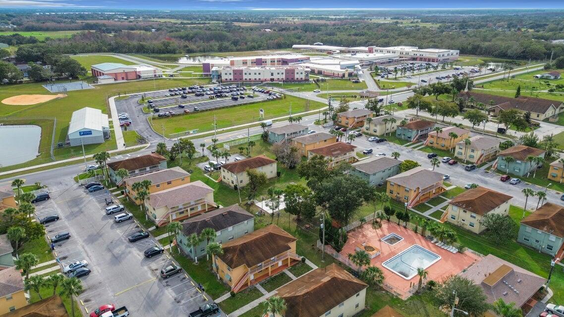 694 Michigan Court, Unit 3 St. Cloud, FL 34769 - Photo 24 of 24 an aerial view of residential houses with outdoor space