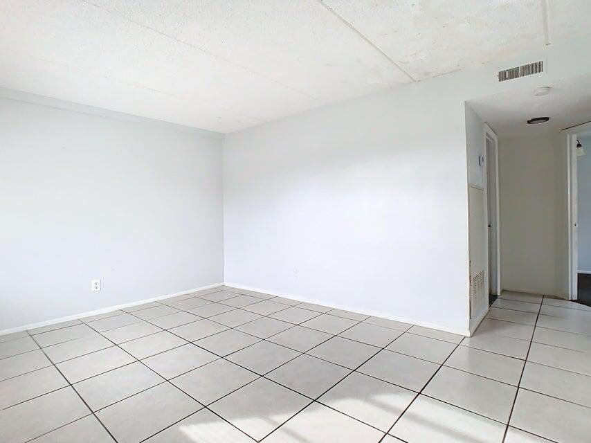 694 Michigan Court, Unit 3 St. Cloud, FL 34769 - Photo 6 of 24 a view of an empty room