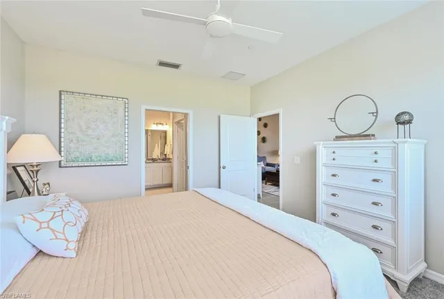 a bedroom with a bed and a dresser