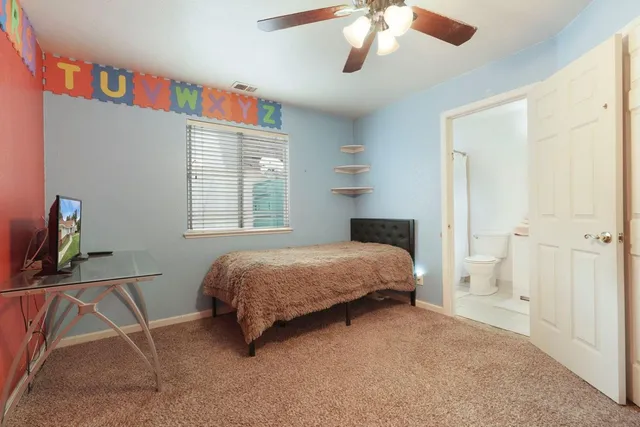 a bedroom with a bed and a cabinets
