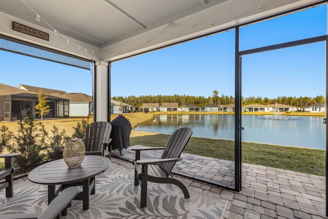 727 Cool Breeze Way Yulee, FL 32097 - Photo 16 of 34 a view of a chairs and table in the patio