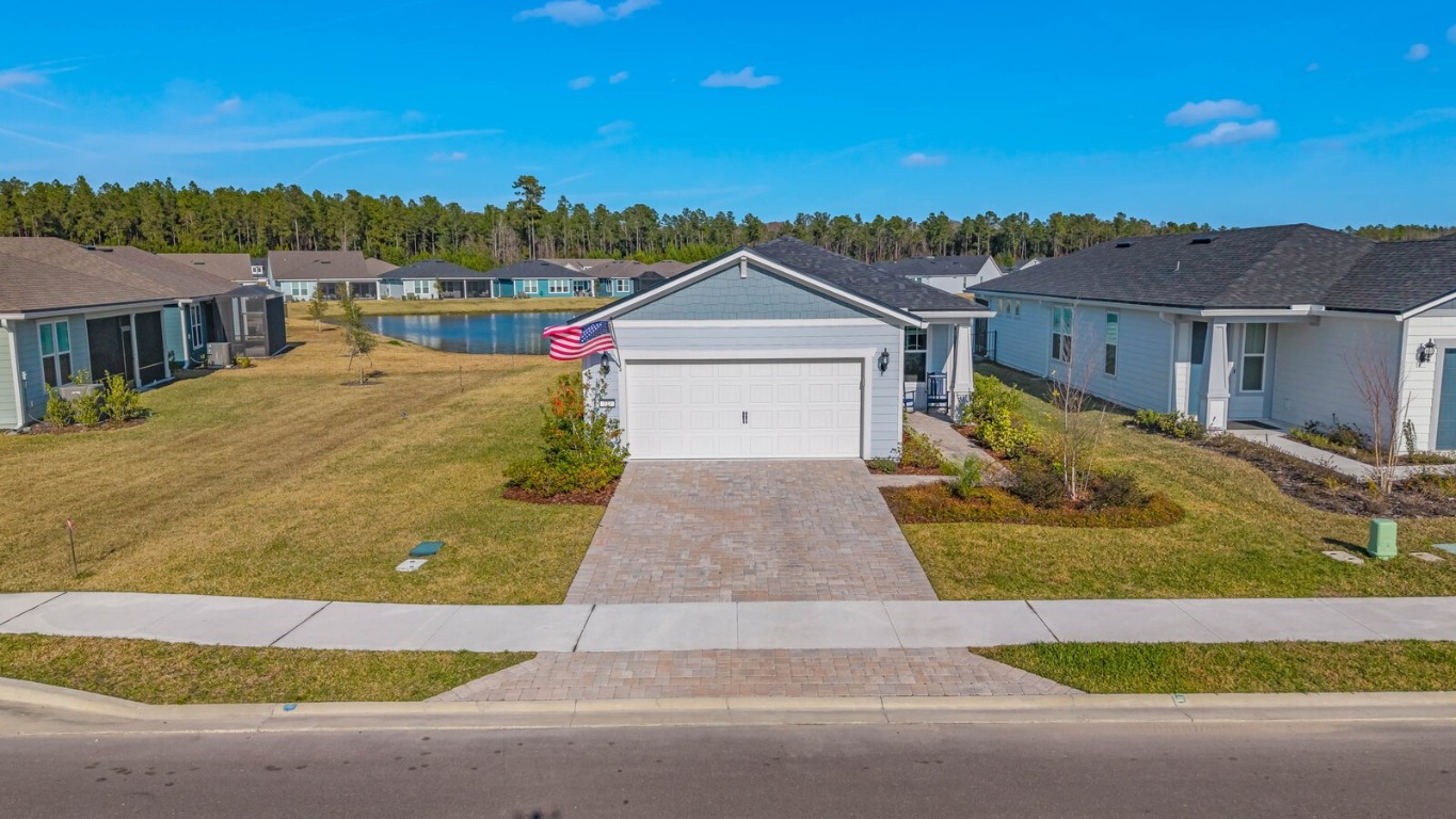 727 Cool Breeze Way Yulee, FL 32097 - Photo 19 of 34 a front view of a house with a yard