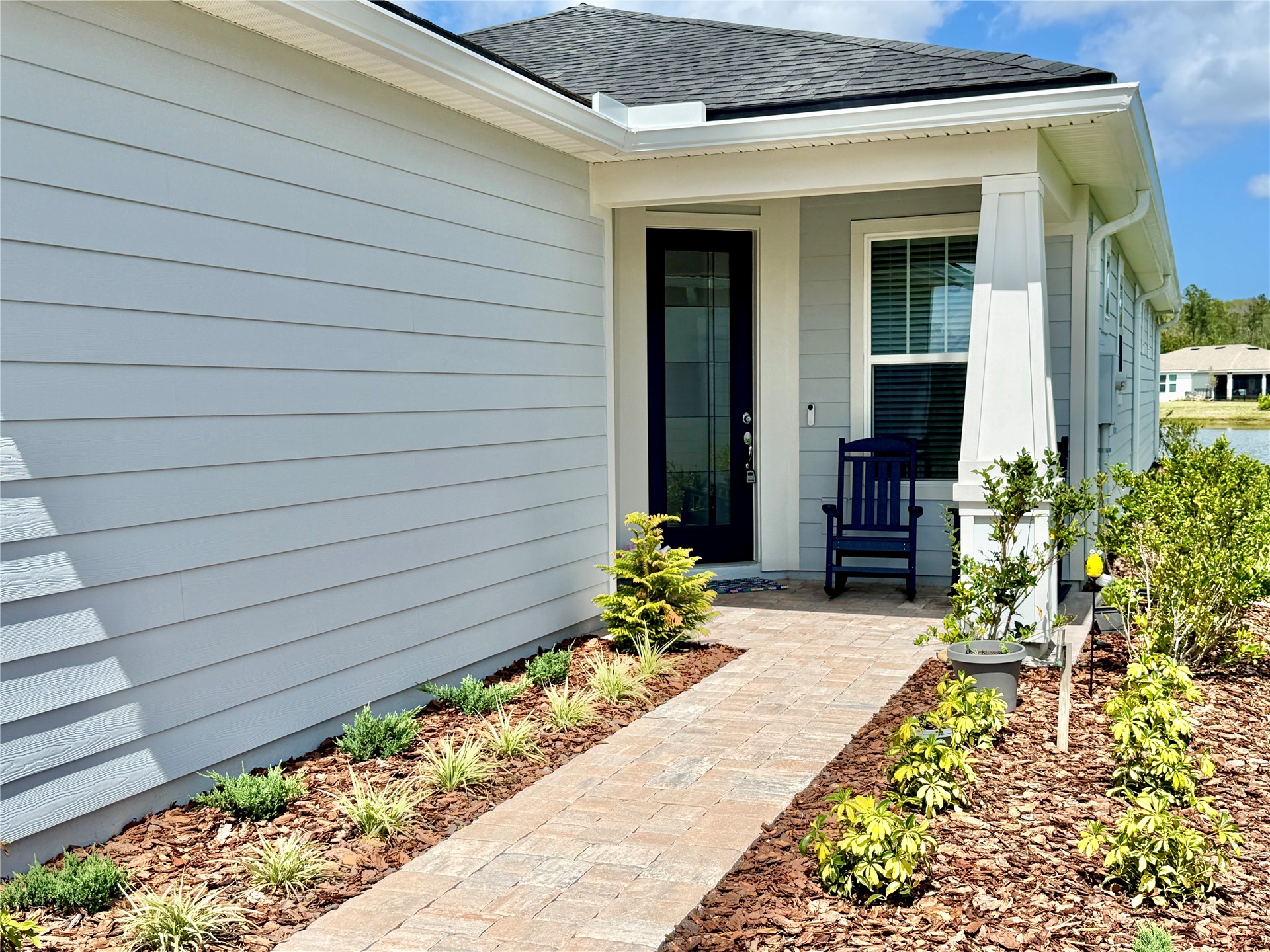 727 Cool Breeze Way Yulee, FL 32097 - Photo 2 of 31 a view of a pathway besides a house