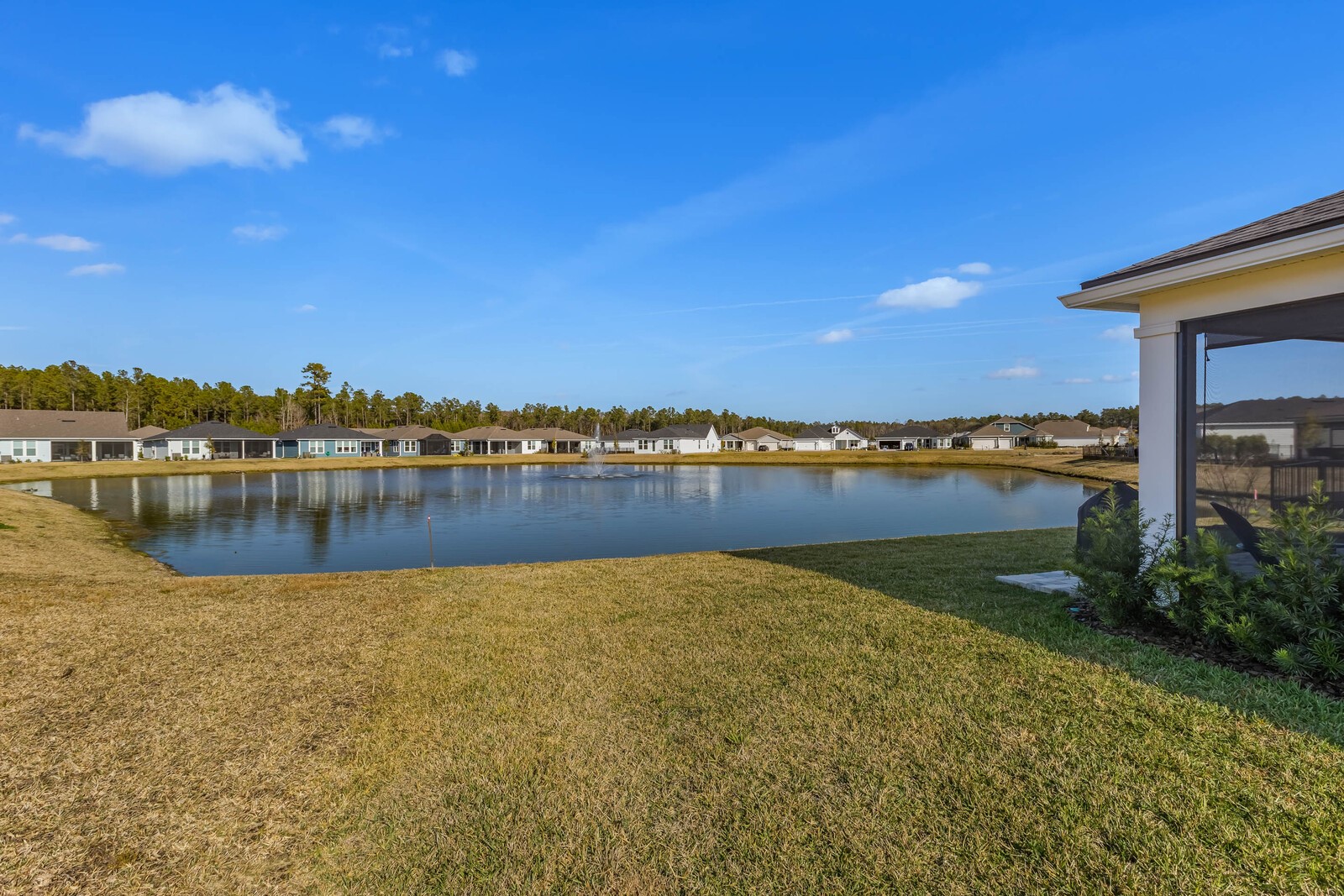 727 Cool Breeze Way Yulee, FL 32097 - Photo 21 of 31 a view of a lake with houses in the back